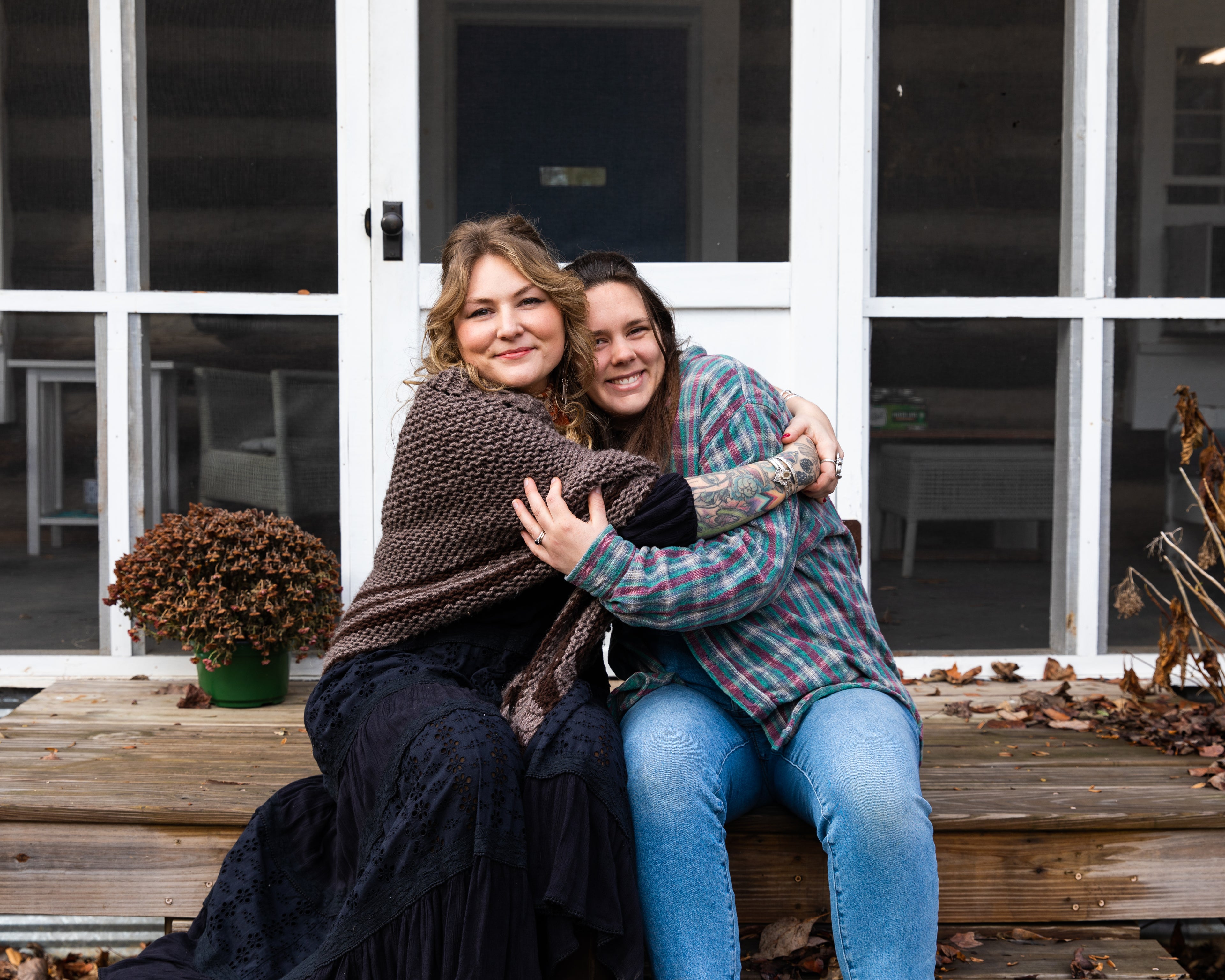 Mary and Tori, Cedar Hill Homestead herbalists, sitting on a porch
